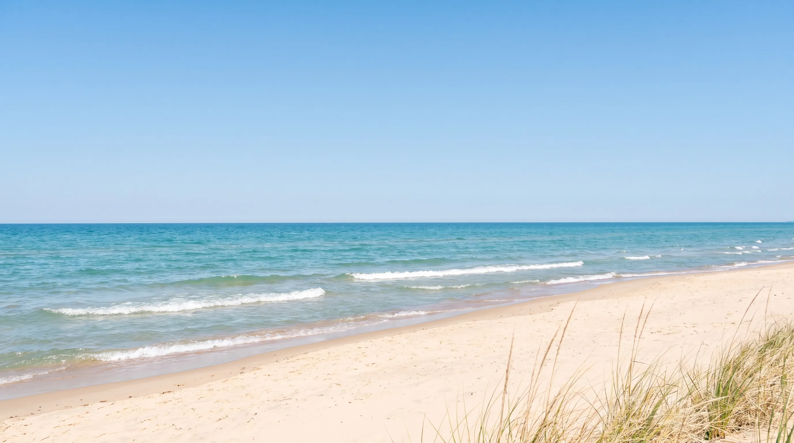 Illustrative Lake Michigan style beach with gentle waves and dune grass